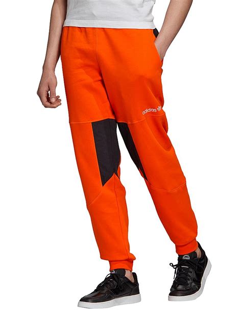 adidas jogginghose außen schwarz innen oranges netz